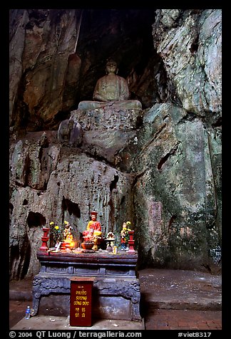 Altar and Buddha statue in a troglodyte sanctuary of the Marble Mountains. Da Nang, Vietnam