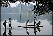 Children playing,  Hoan Kiem Lake. Hanoi, Vietnam ( color)